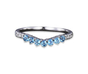 Elegant blue topaz wedding ring featuring shimmering zircon accents in a timeless sterling silver band